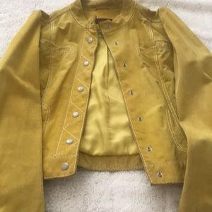 Used Yellow Danier Jacket. Good  condition with a little stain of cosmetic.